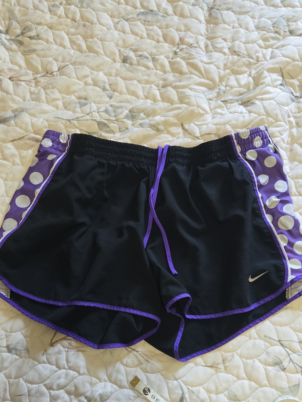 Nike Women’s Black Shorts with Purple Polka-Dot Side Panels